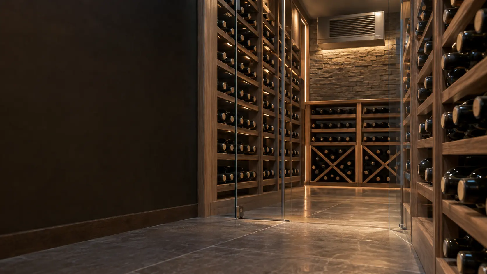 A wine cellar with a wall-mounted evaporator and glass walls, seen close and low along the racks.